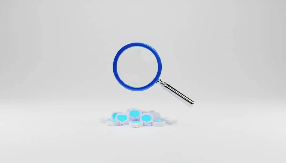 A chrome and blue magnifying glass over a pile of white speech bubbles, some glowing