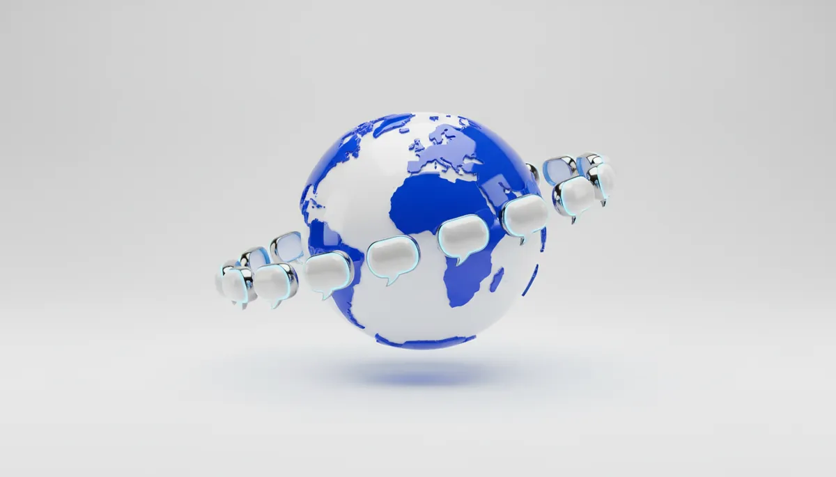 A glossy blue and white globe orbited by small white speech bubbles